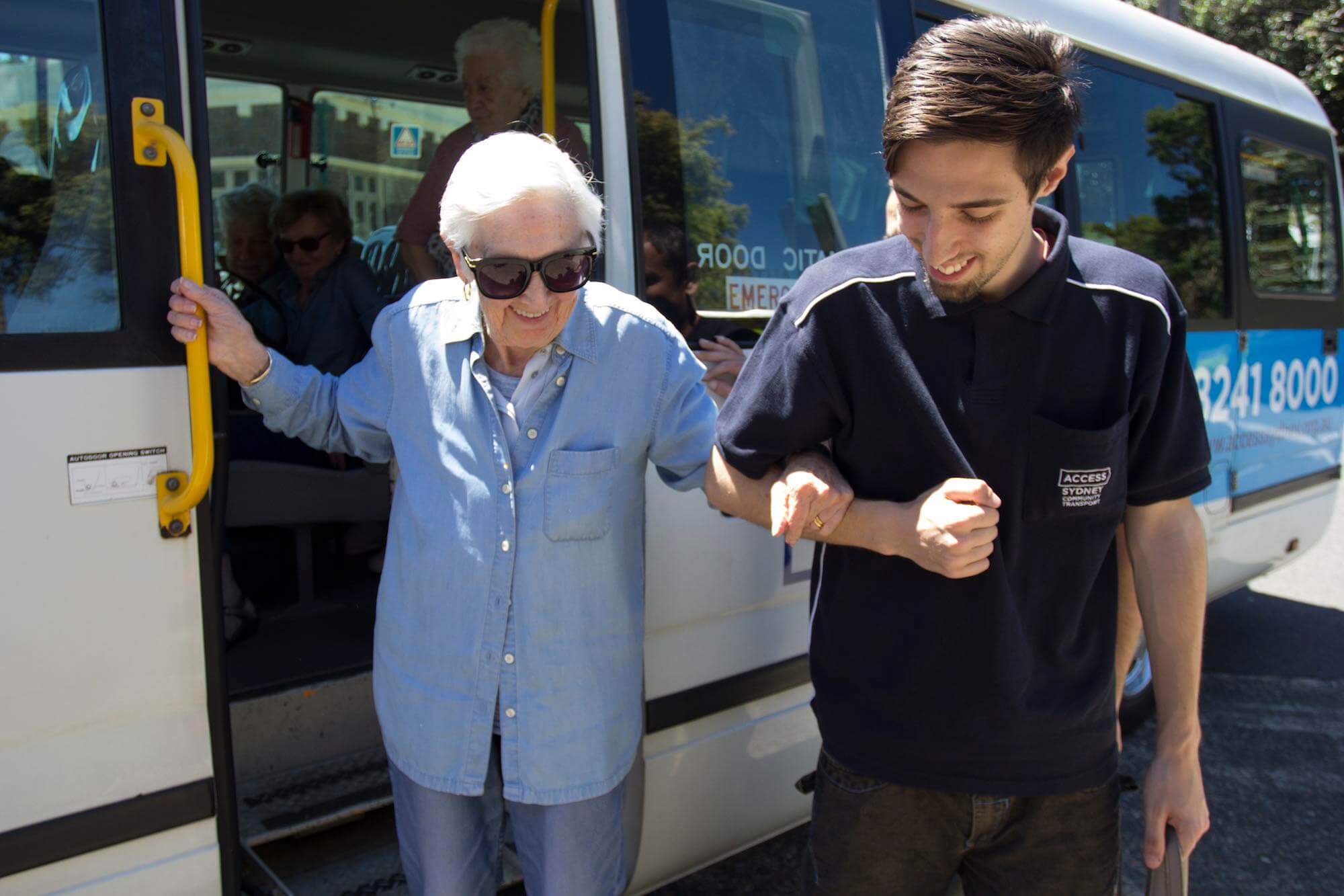 Bus assistant with elderly passenger